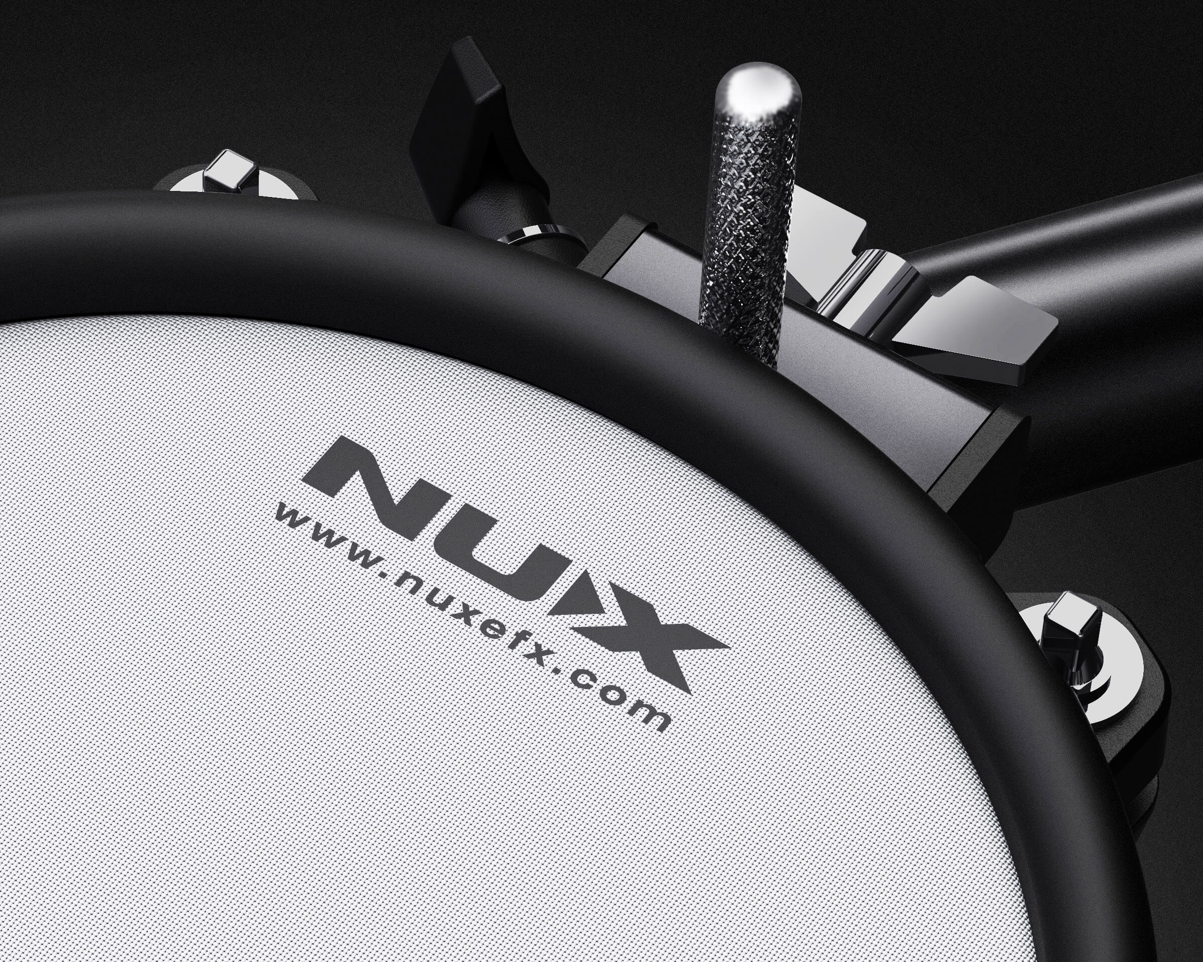Nux electronic drum pad with a black rim on a dark background