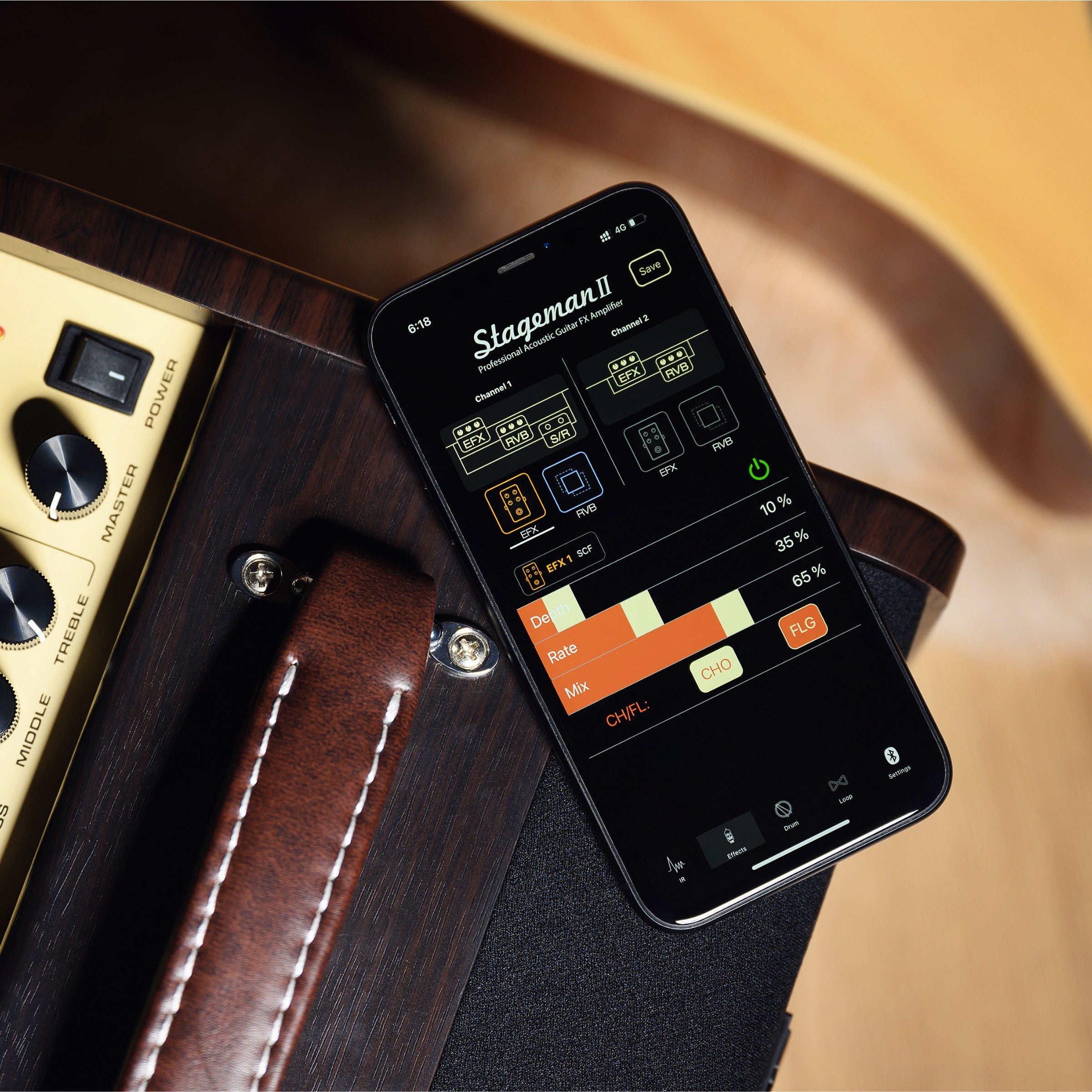 Close-up of a Stageman II amplifier with control knobs and labels.