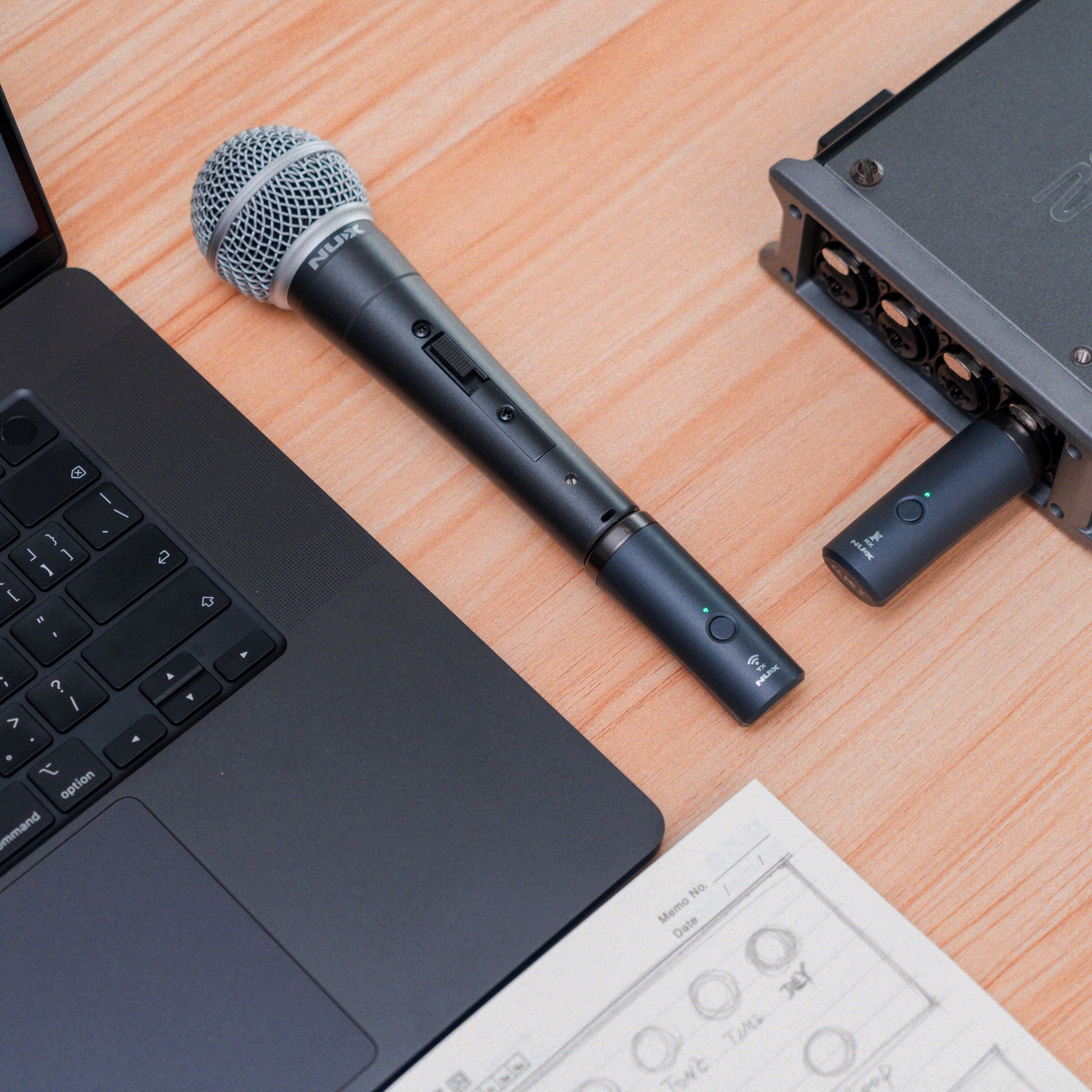 NUX B-3RC Microphone and audio interface on a wooden surface with a laptop