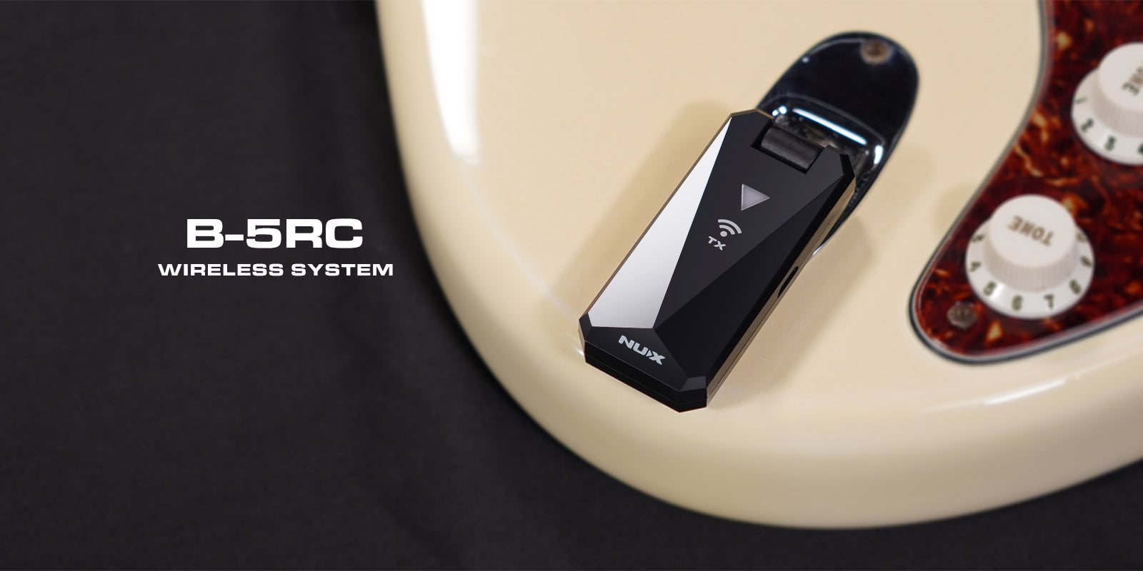 Fender guitar with B-5RC wireless system on a guitar body with a black background