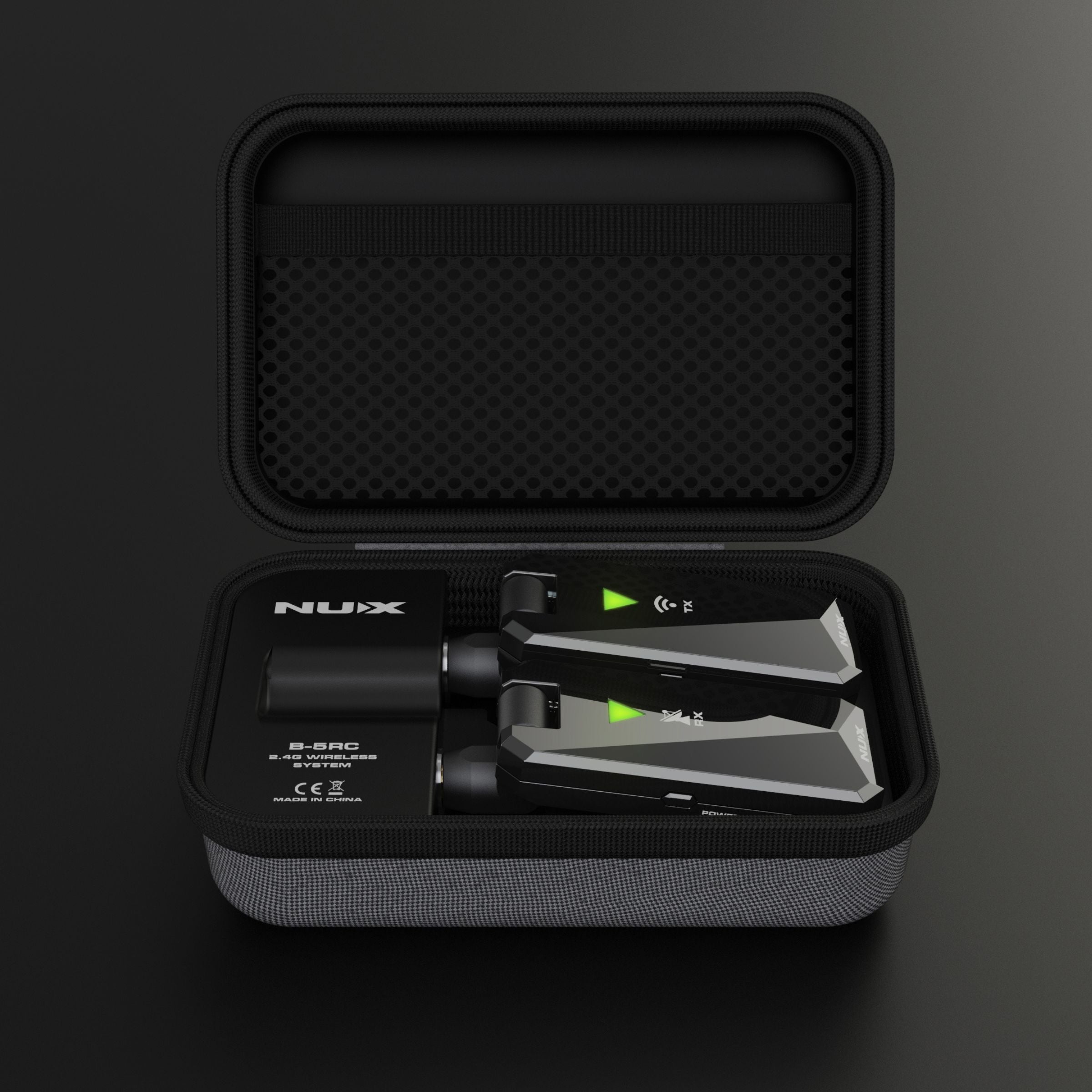 NUX B-5RC wireless guitar system with transmitter and receiver inside its portable charging case.