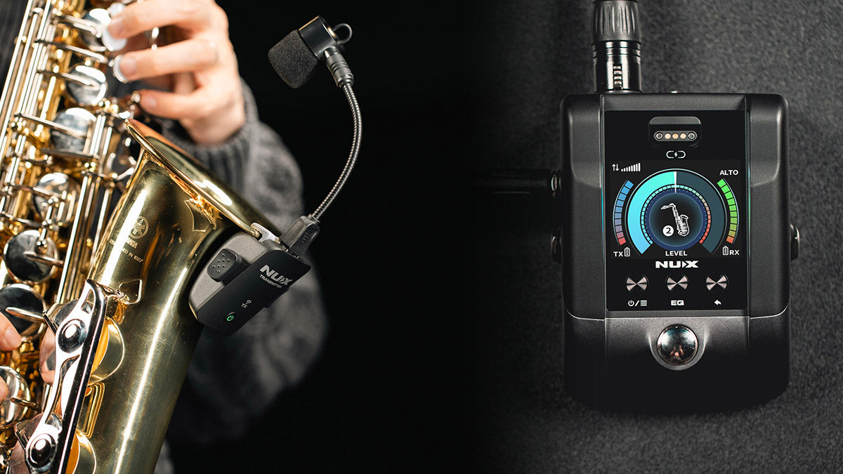 Saxophone with a NUX B-6 PRO microphone clipped on the rim and tuner on a dark background