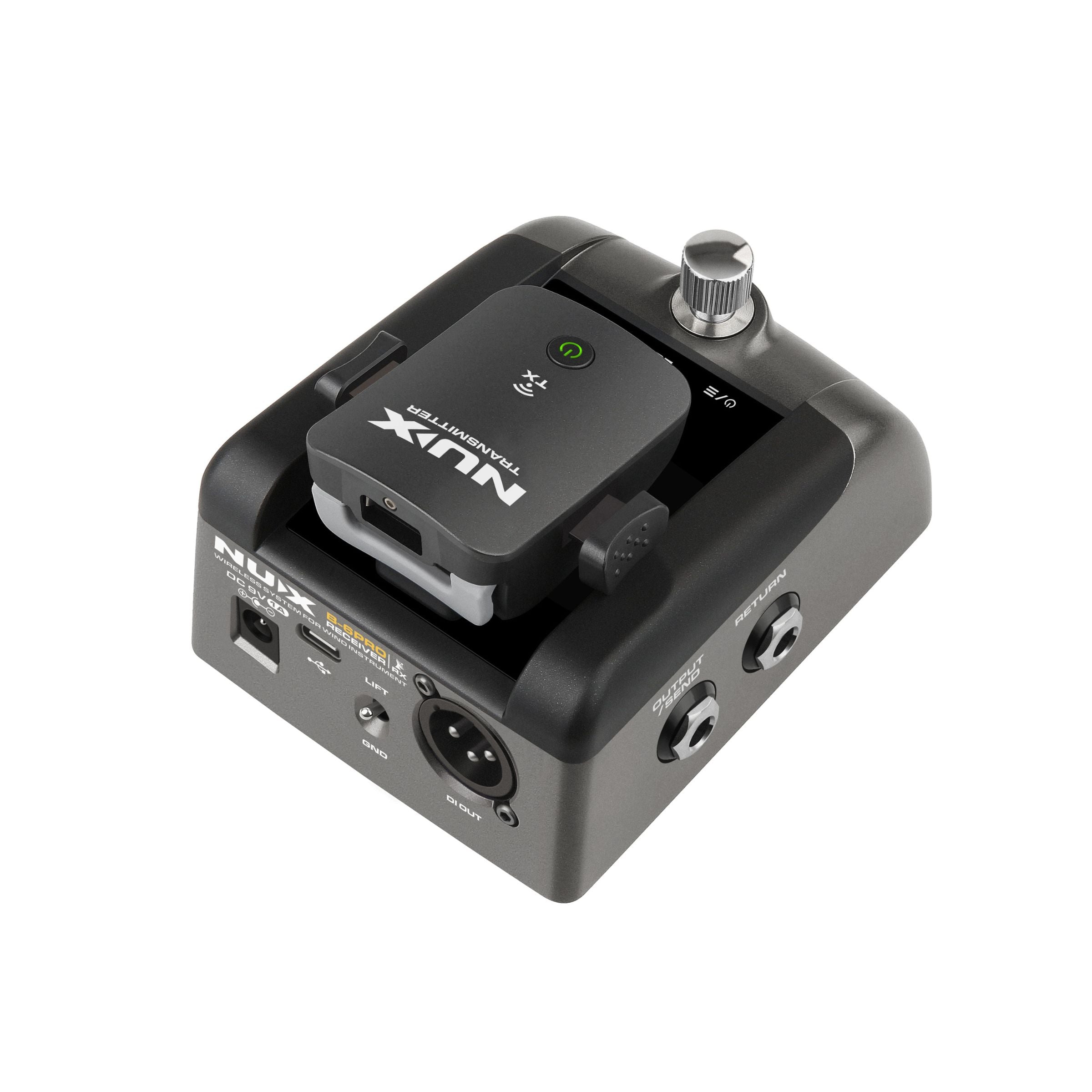 NUX B-6 PR0 pedal receiver with magnetic clip that secures the transmitter on top of the receiver for quick charging.