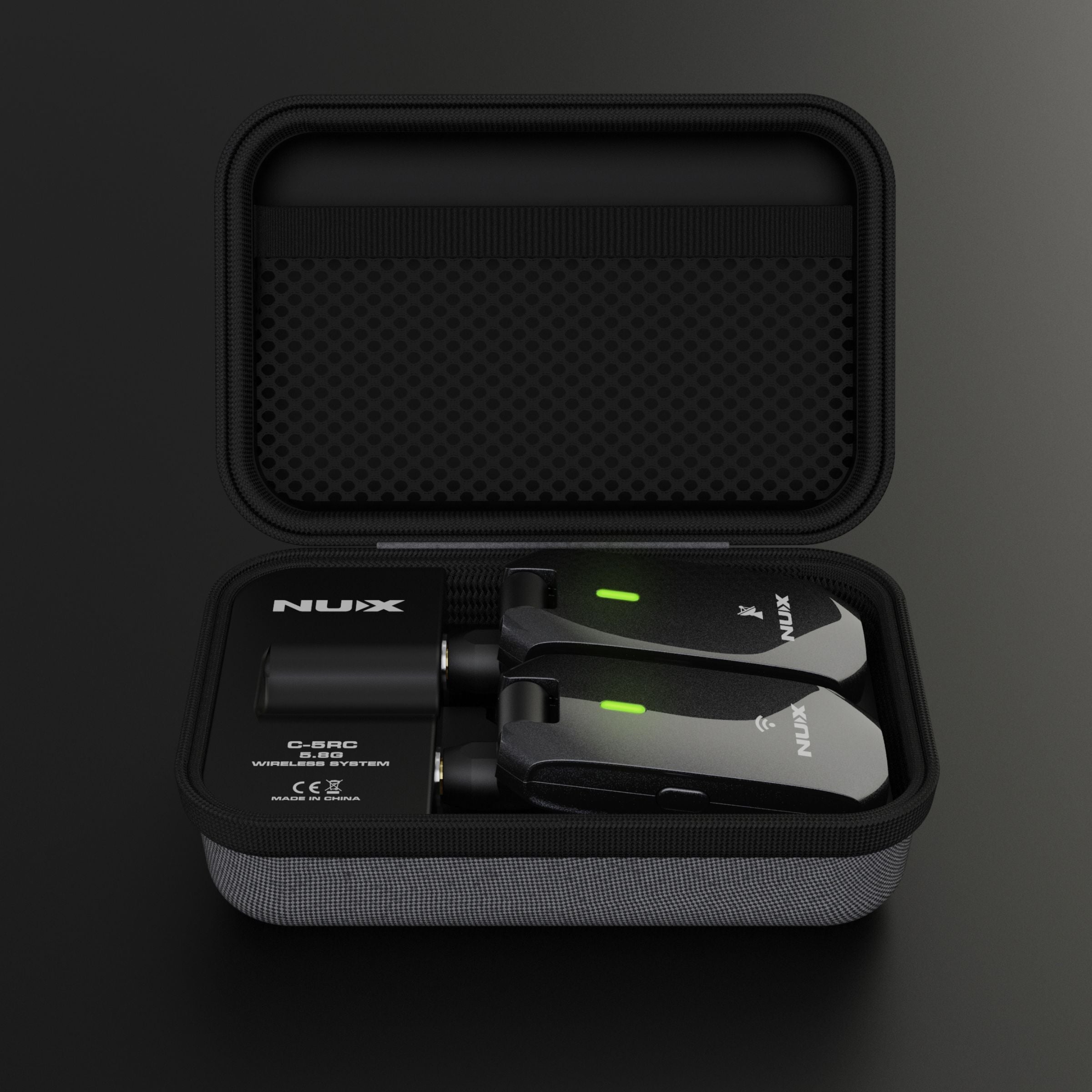 NUX C-5RC wireless guitar system transmitted and receiver in the included charging case.