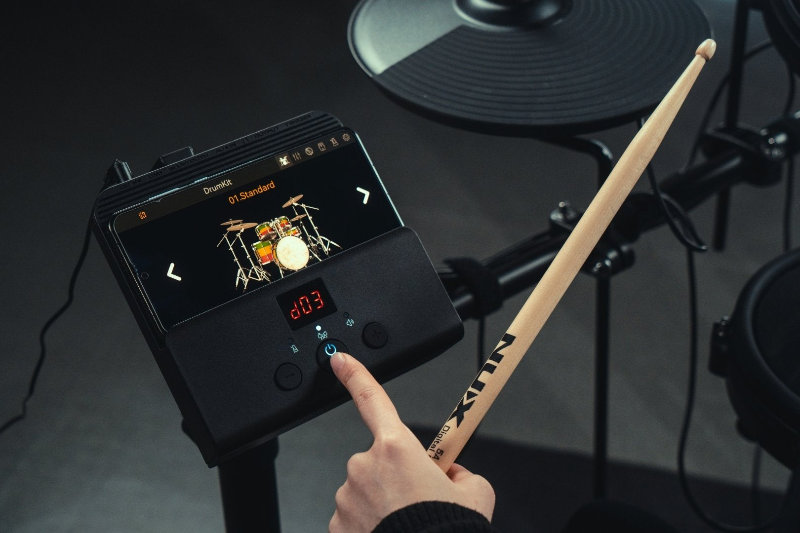 NUX DM-110 Module with smartphone connected to the app