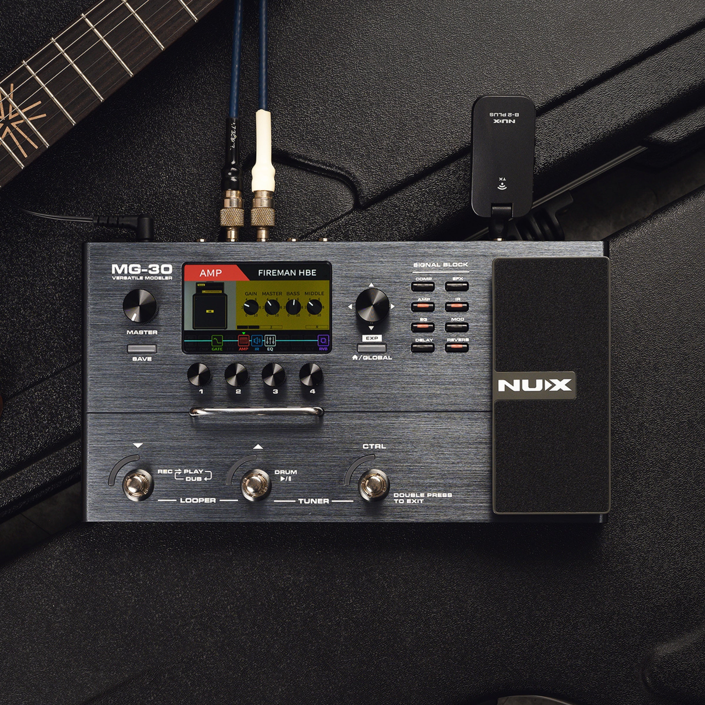 Nux MG-30 guitar effects pedal on a black background with a guitar partially visible.