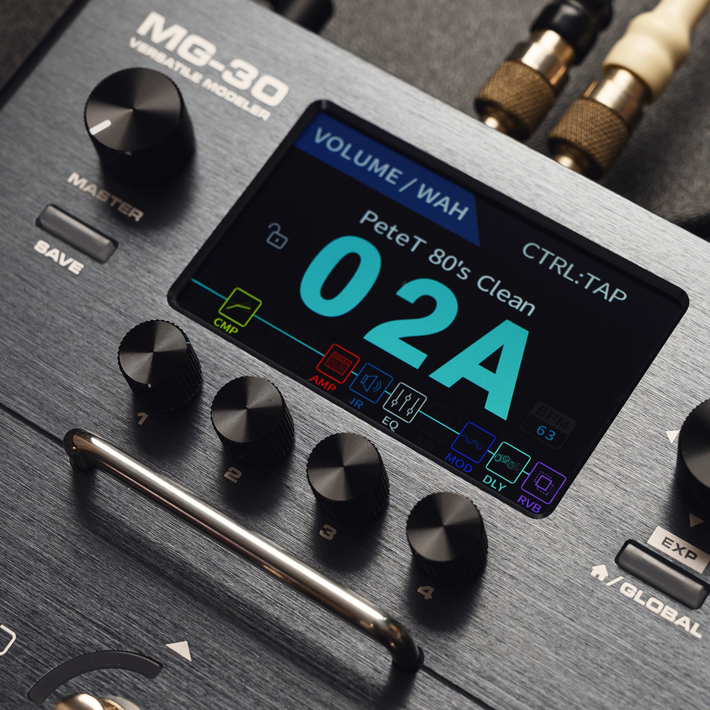 Close-up of a guitar effects pedal with digital display and control knobs.