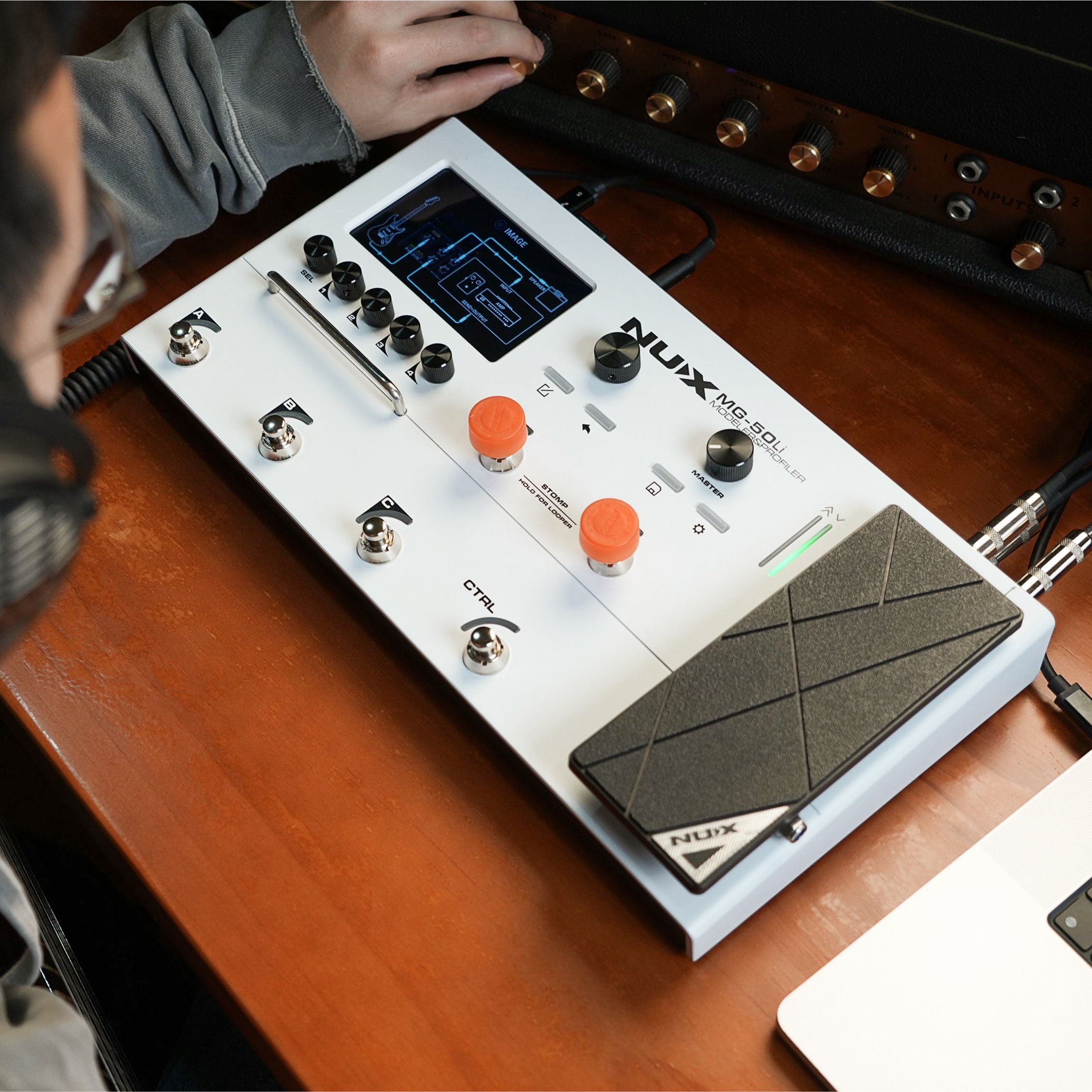 person profiling an amp using the NUX MG-50Li