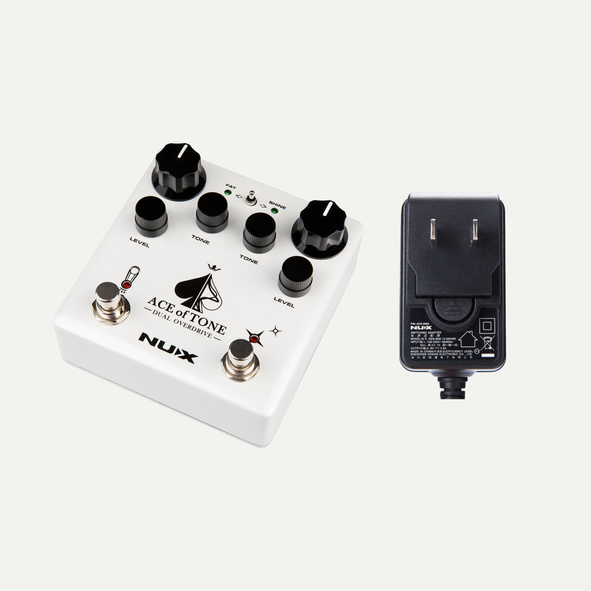 NUX Ace of Tone angled view next to the ACD-006A power adapter