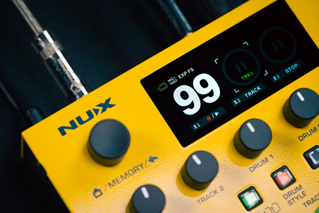 Yellow NUX dual loop stereo lcd screen showing 99 number