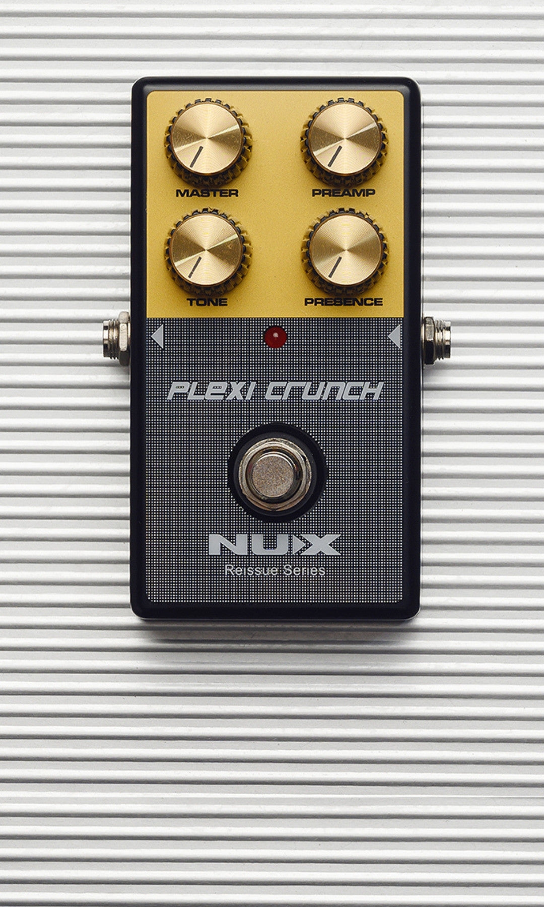 Nux Plexi Crunch guitar effects pedal on a metallic background