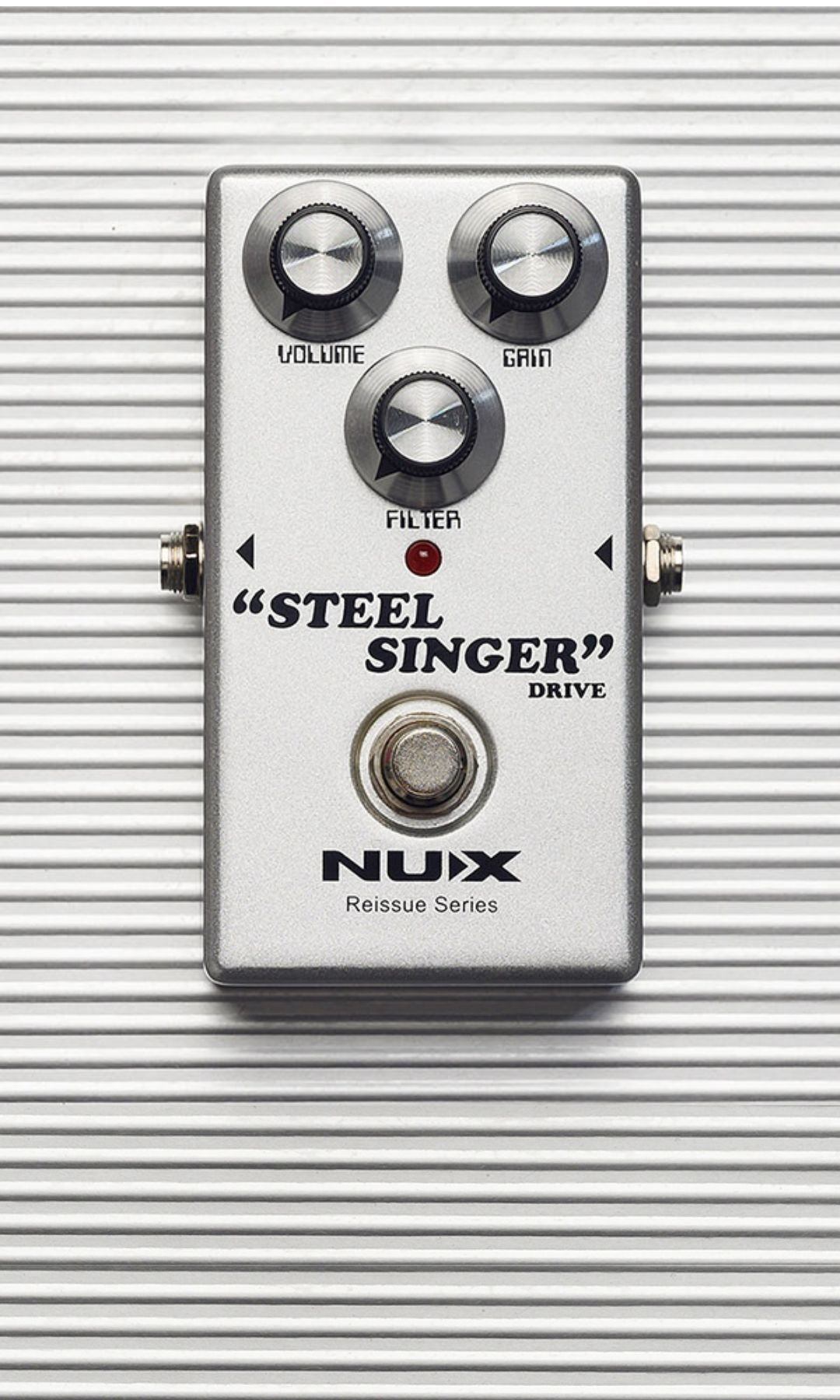 Guitar effects pedal with 'Steel Singer' and 'Nux' branding on a metallic background