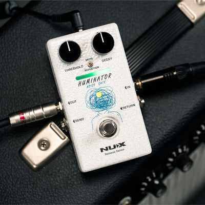 Nux Huminator guitar effects pedal on a textured surface