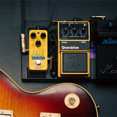 NUX A/B Roll mini core effects pedal on a stompbox next to nobels overdrive