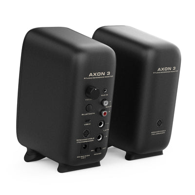 Pair of black AXON 3 studio reference monitors on a white background