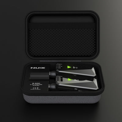 NUX B-5RC wireless guitar system with transmitter and receiver inside its portable charging case.