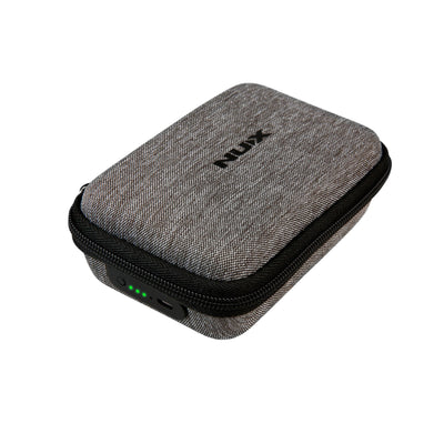 NUX B-5RC portable charging case with NUX logo on top and battery indicator, and charger on its side.