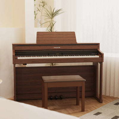 Wooden NUX digital piano with bench in a room setting