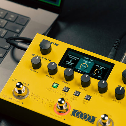 yellow NUX dual loop stereo pedal stompbox with LCD screen connected to a laptop