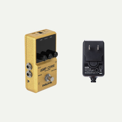 NUX Amp Core Studio angled view next to the ACD-006A power adapter
