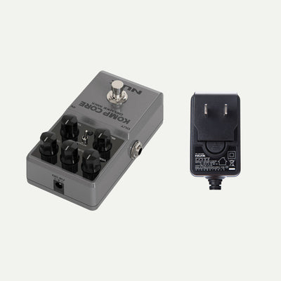 NUX Komp Core Deluxe MKII angled view next to the ACD-006A power adapter