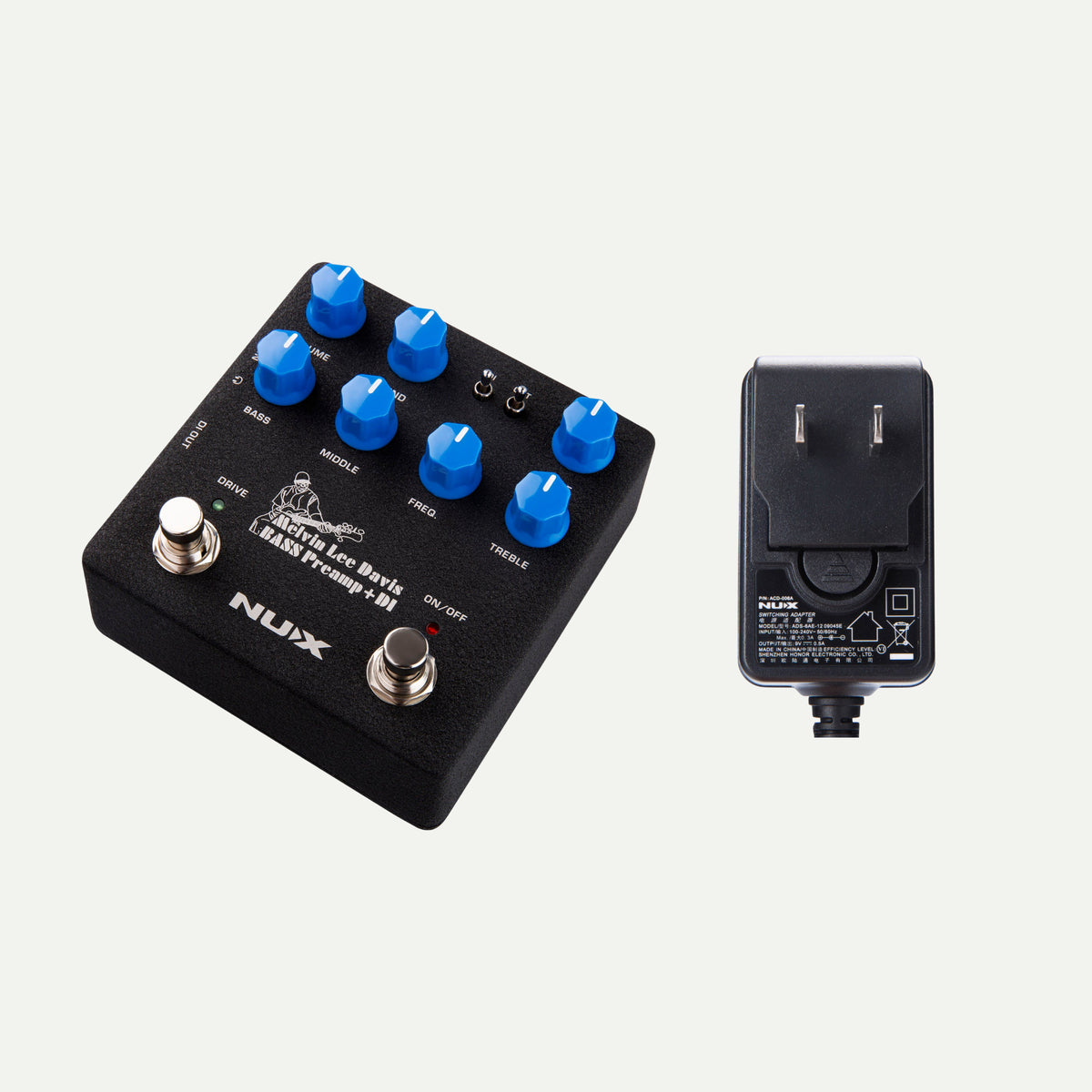 NUX MLD Bass Preamp & DI angled view next to the ACD-006A power adapter