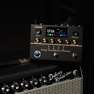 NUX amp academy stomp with LCD screen multi switch pedal stompbox on an amp