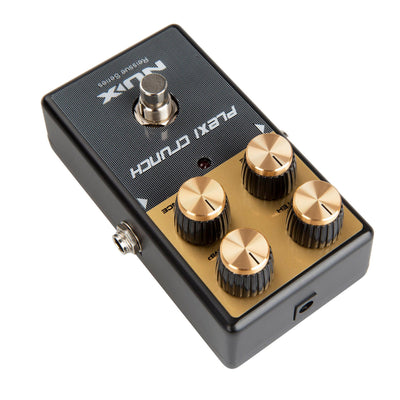 NUX Guitar effects pedal with gold knobs on a white background