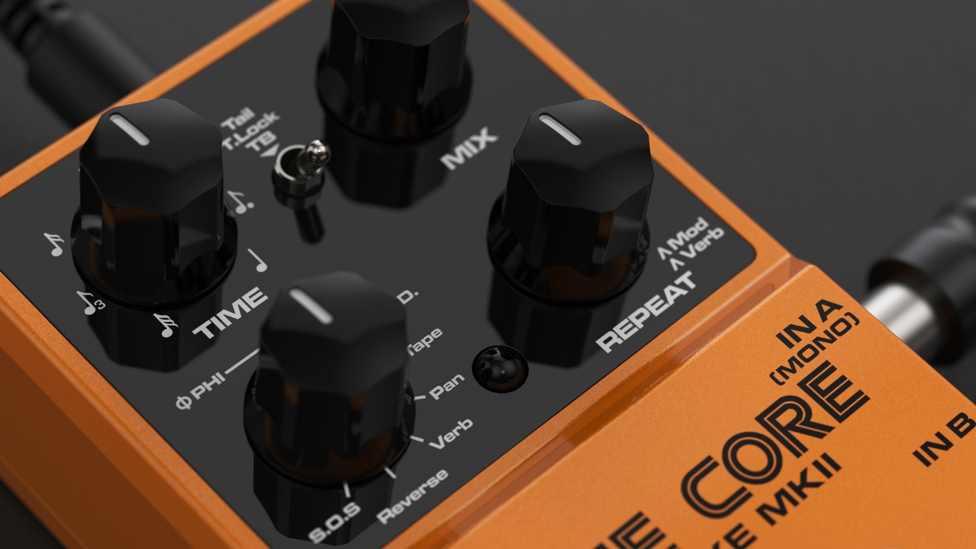 Close-up of a guitar effects pedal with orange and black design