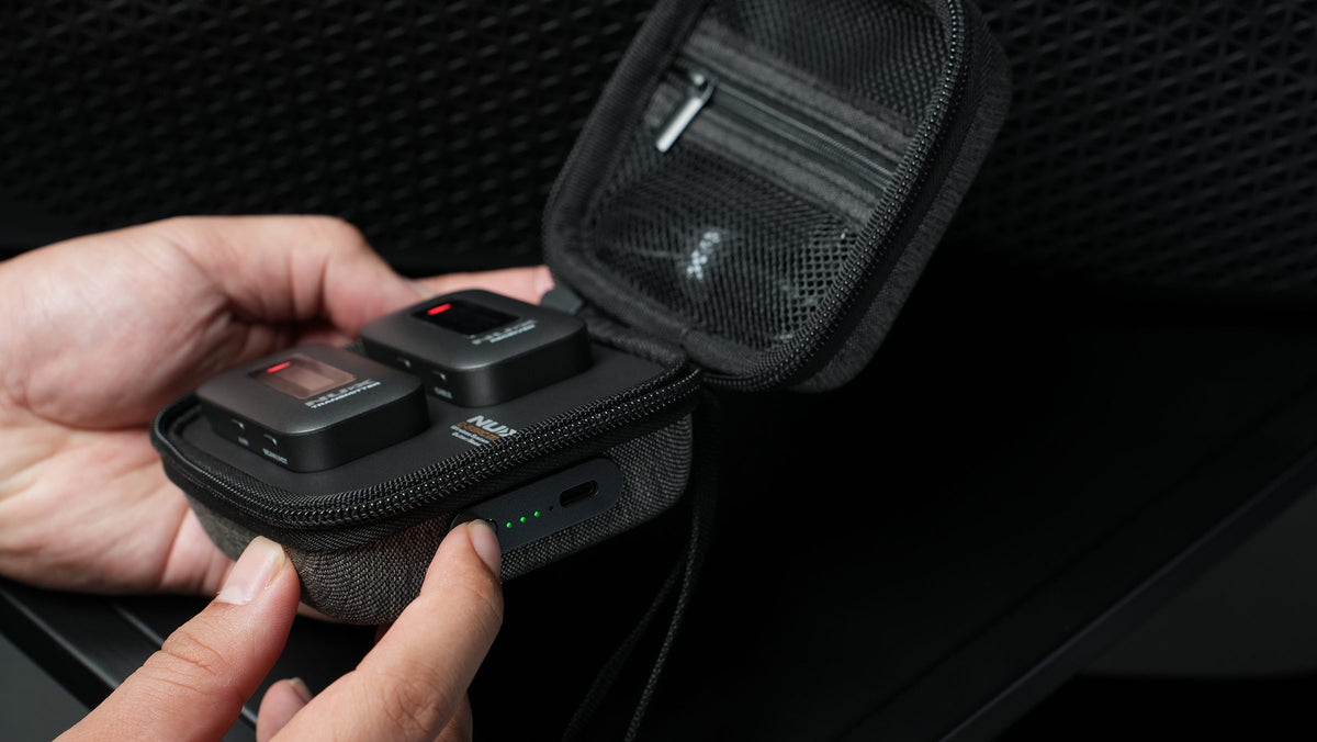Placing the NUX C-58RC units into the magnetic charging case