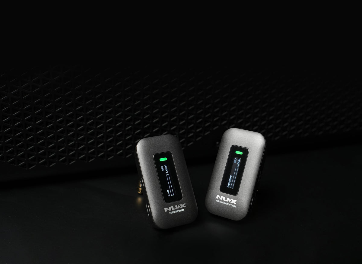 NUX C-58RC 5.8GHz wireless receiver and transmitter in front of an amplifier