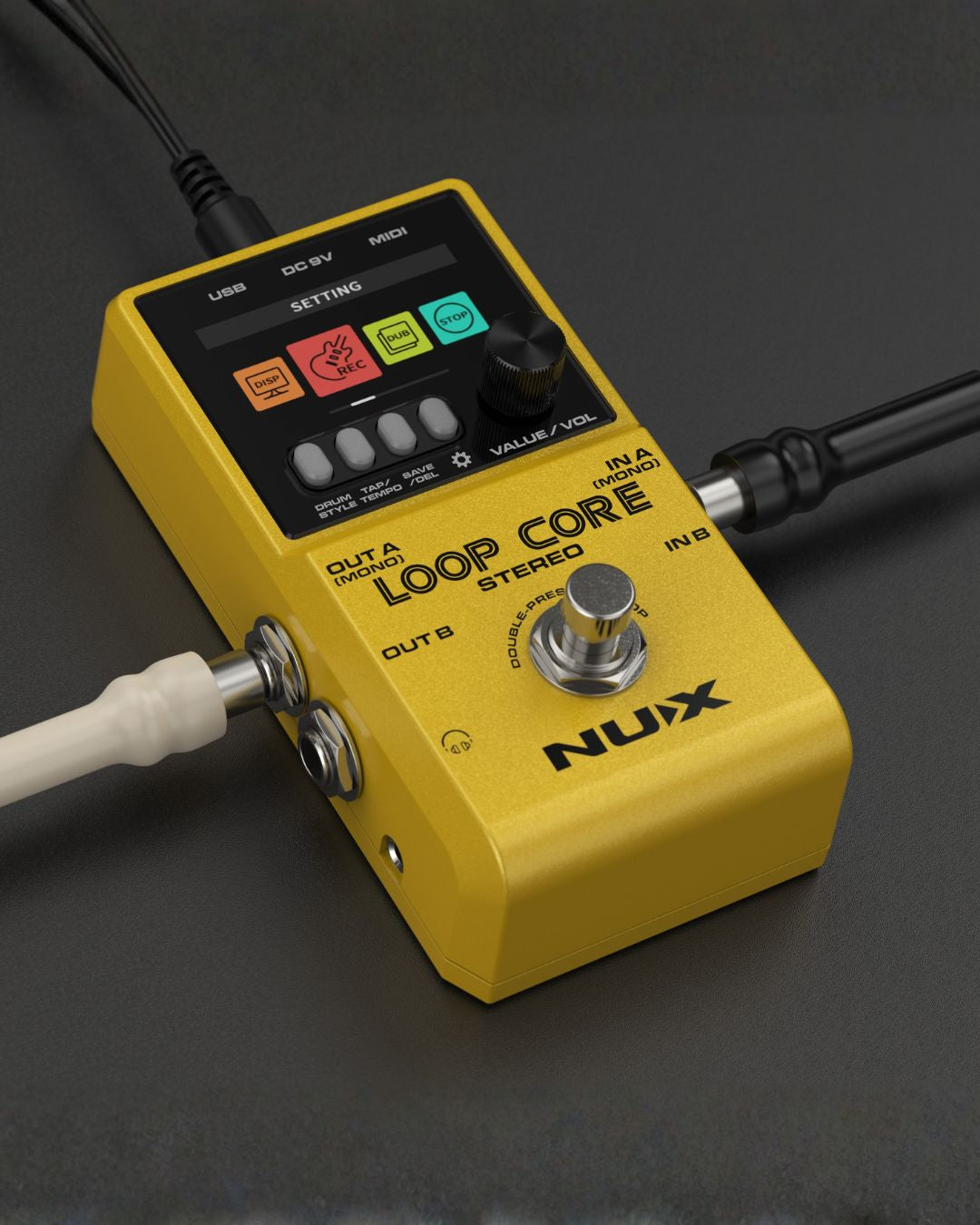 Yellow Nux Loop Core stereo pedal with cables on a dark background
