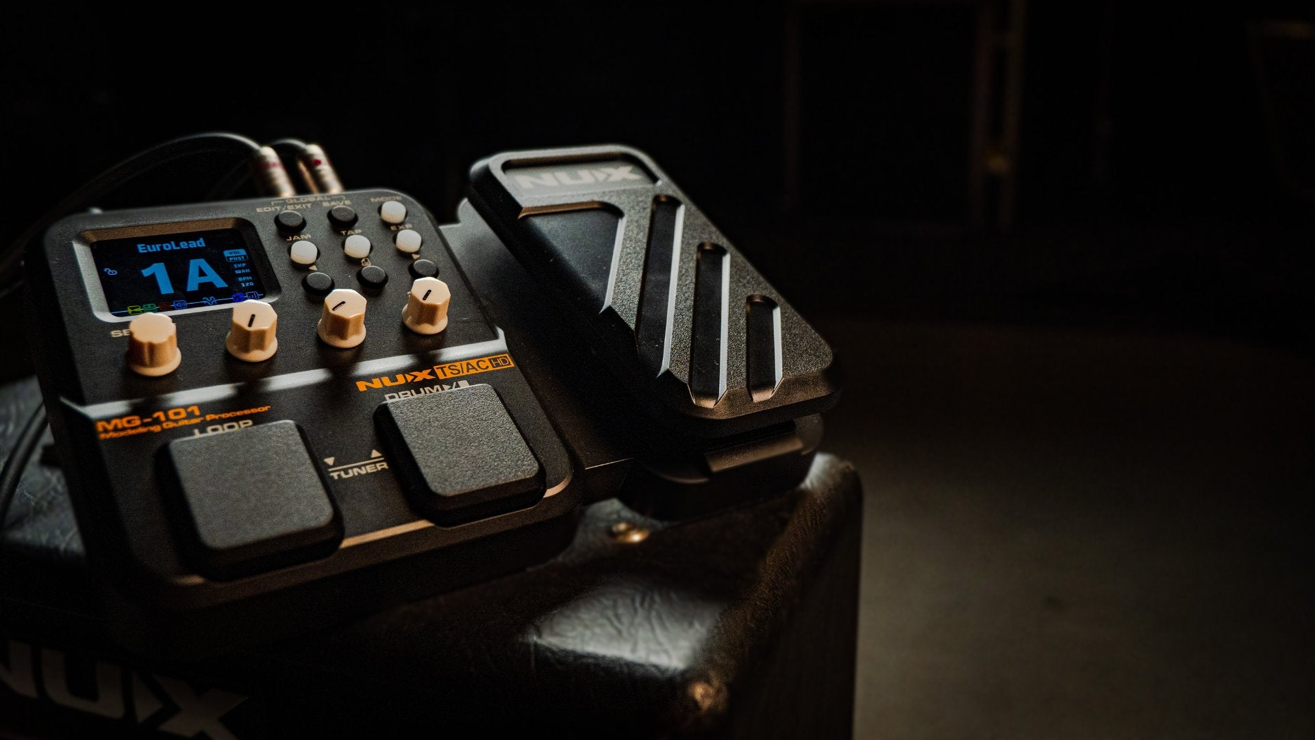NU-X mg-101 on an amp in a dark room