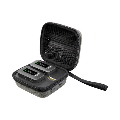NUX C-58RC wireless guitar system transmitter and receiver charging inside the open magnetic charging case