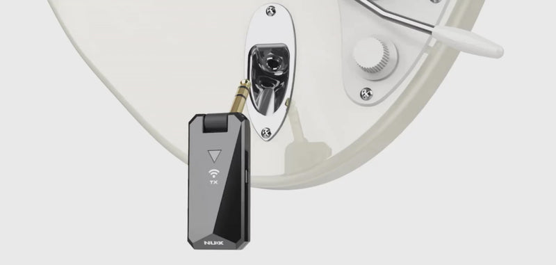 NUX B-5RC Transmitter plugging into an electric guitar to show how the whammy bar doesn't interfere with the wireless system.