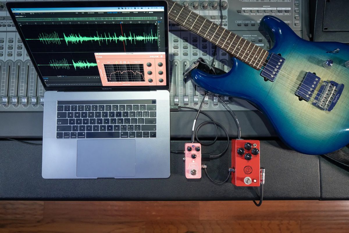 NUX Pulse mini cab IR loader plugged into a laptop that is showing the UI interface of the downloaded editor tool.