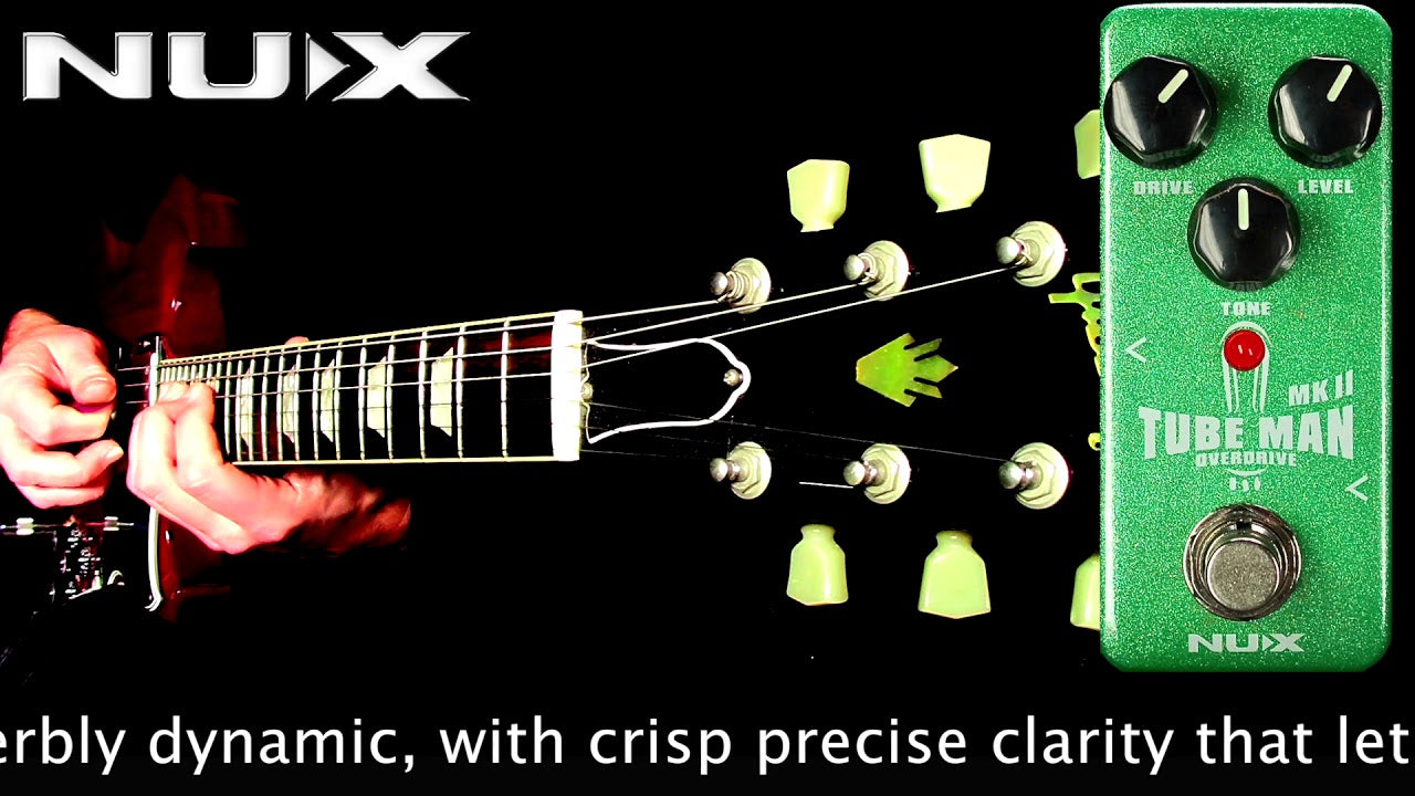 Nux Tube Man MKII guitar effects pedal with a guitar and hand on a black background